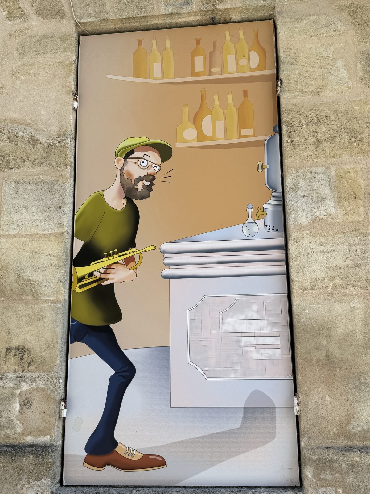 A whimsical painted door mural of a trumpet player in an old apothecary — Liz's shot captures the charm of Bordeaux's side streets.