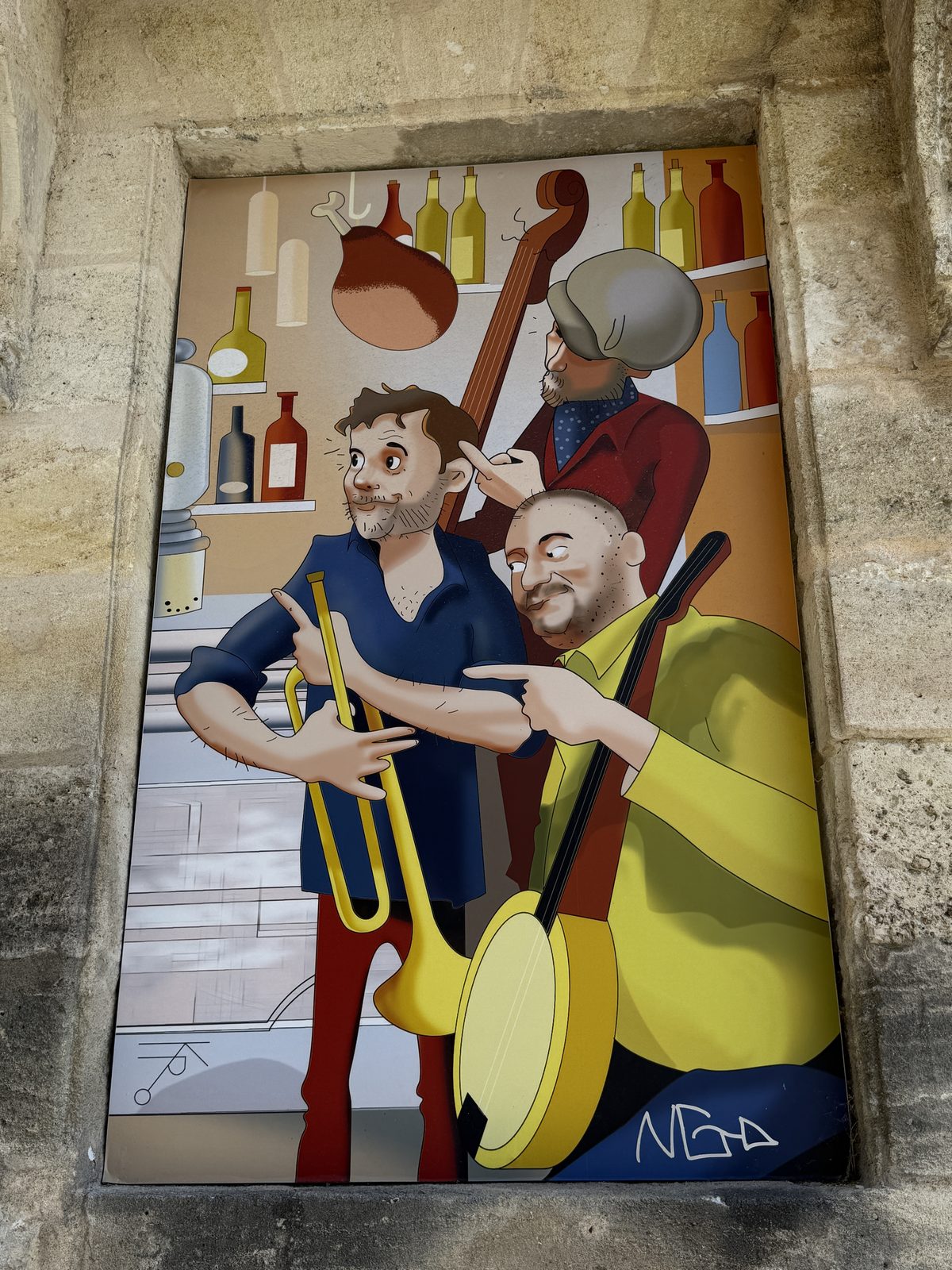 The companion mural next door — a trio of street musicians playing their instruments.